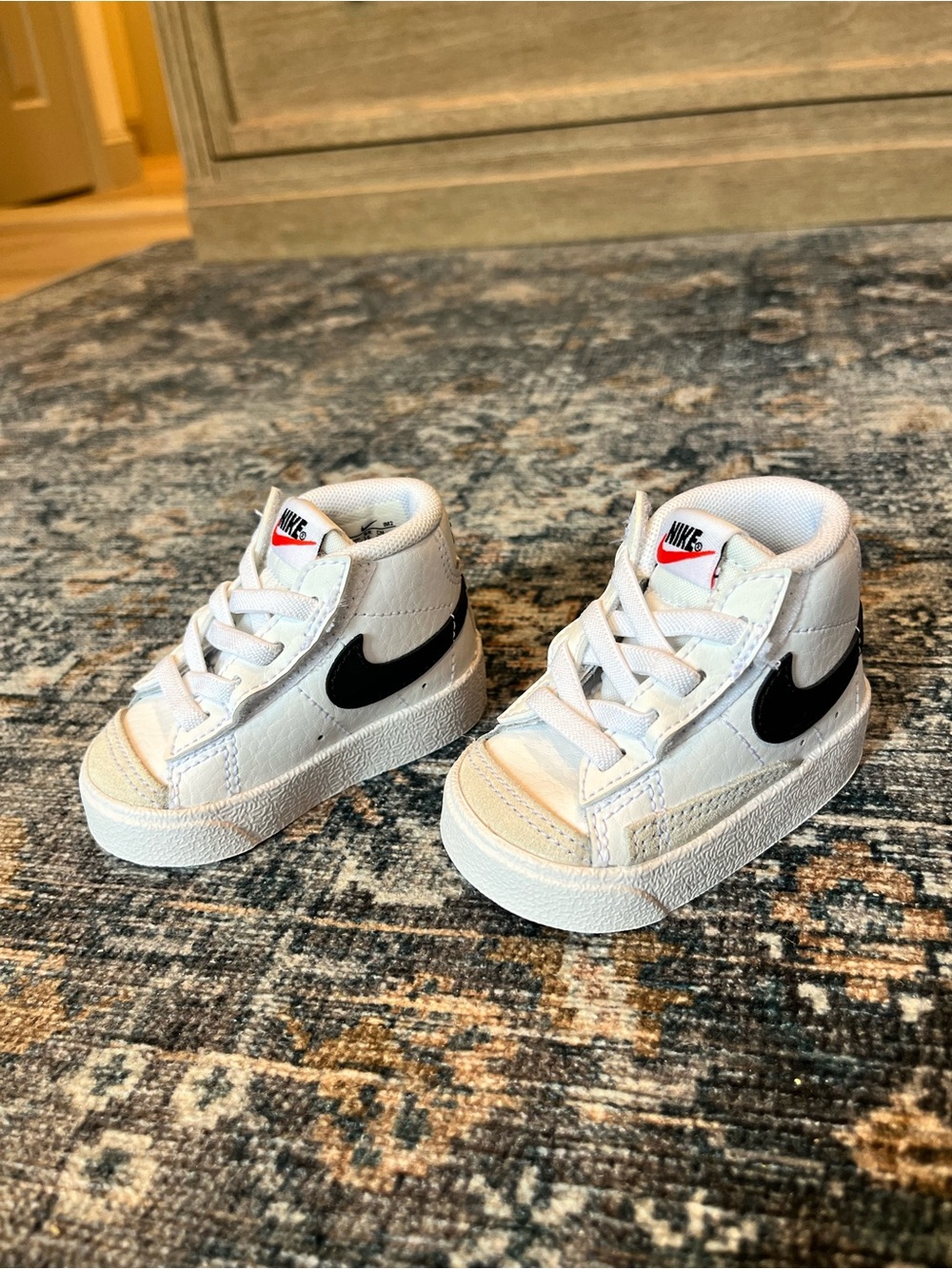 Nike Kids White High-Top Sneakers with Black Swoosh and Red Logo